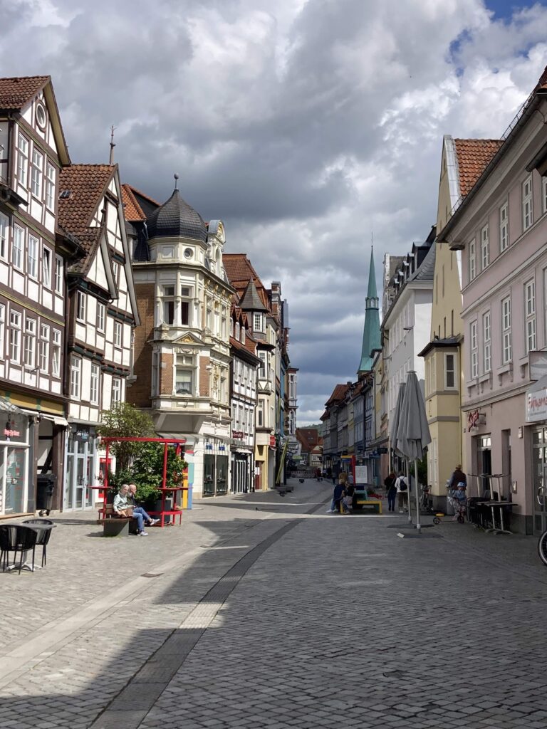 Image showing the town of Hamelin or Hameln, with half-timbered buildings and cobblestone streets under a cloudy sky